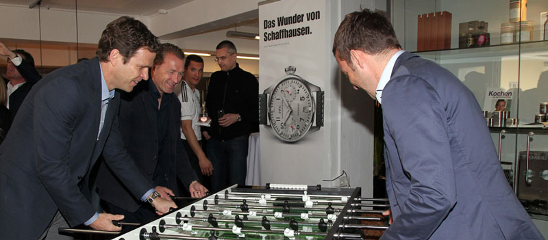 Oliver Bierhoff, Andreas Koepke, and goalkeeping coach Hans-Dieter Flick are playing table soccer