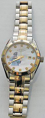 часы Rotary на циферблате которых молодой Каддафи отдает честь